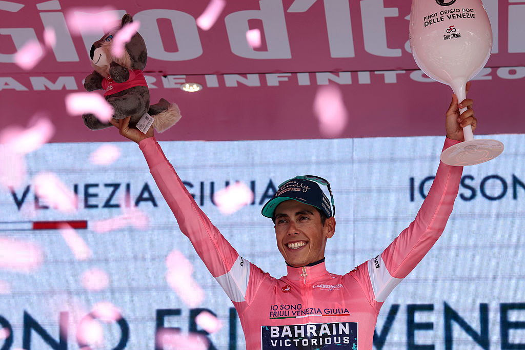 Bahrain - Victorious Portuguese rider Afonso Eulalio celebrates his overall leader pink jersey on the podium after the 10th stage of the Giro d'Italia 2026 - Tour of Italy cycling race, 42km individual time trial between Viareggio and Massa on May 19, 2026. (Photo by Luca Bettini / AFP)