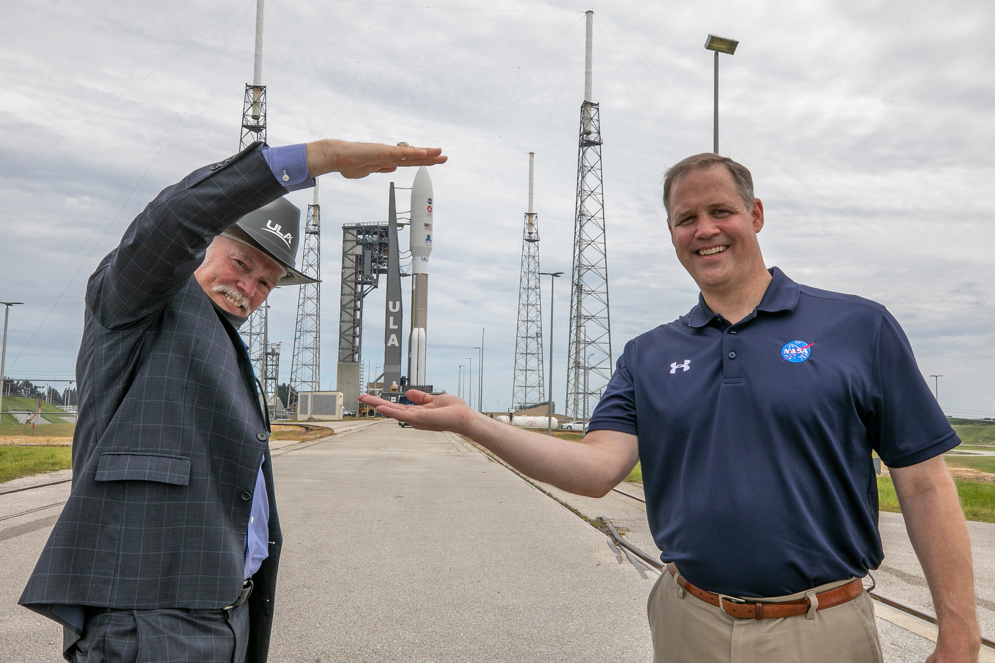 NASA Administrator Jim Bridenstine, at right, and Tory Bruno, CEO of United Launch Alliance (ULA), watch the rollout of the ULA Atlas V 541 rocket, carrying NASA’s Mars Perseverance rover and Ingenuity helicopter, as it rolls along to the launch pad at Space Launch Complex 41 at Cape Canaveral Air Force Station on July 28, 2020.