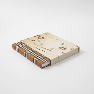 Photograph of Burberry book featuring Burberry check cover