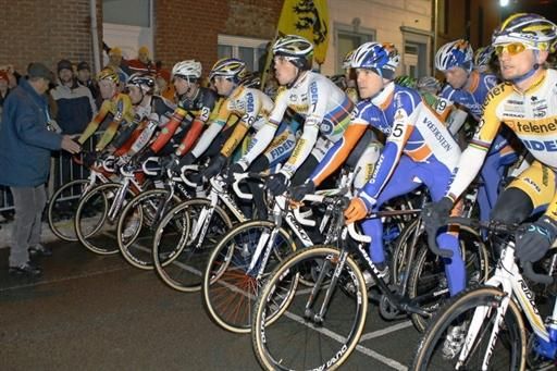 The elite men are ready to start their nighttime race in Diegem, Belgium.