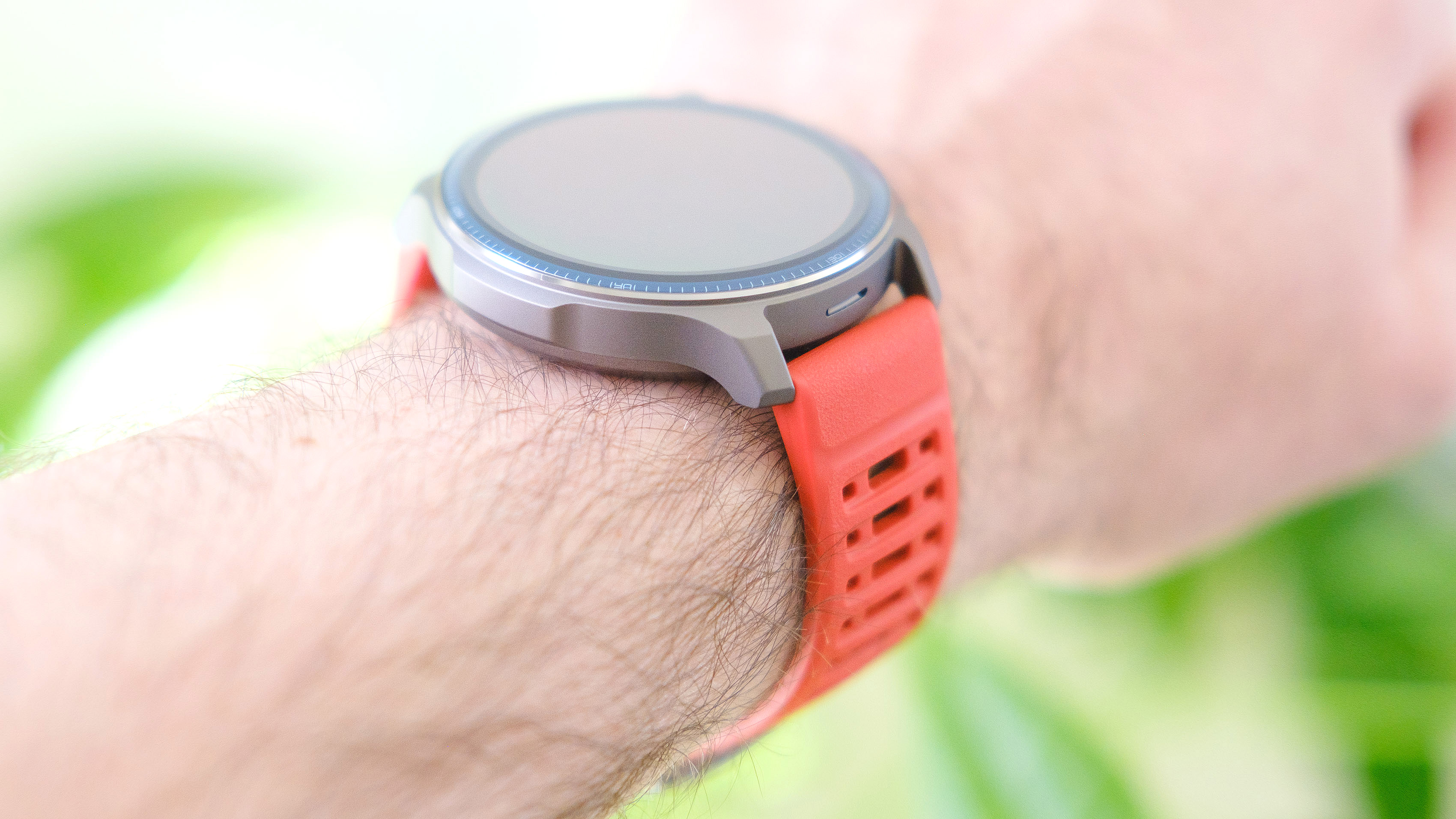 Close-up of the Amazfit Balance 2 smartwatch on an orange rubber strap
