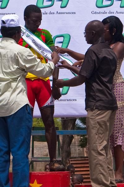 Alphonse receives the &ldquo;lantern rouge&rdquo; award. The prize is intended to encourage riders not to give up.