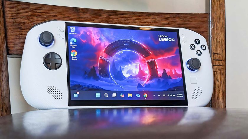 The Legion Go S resting on a chair with a dBrand screen protector installed on it. 