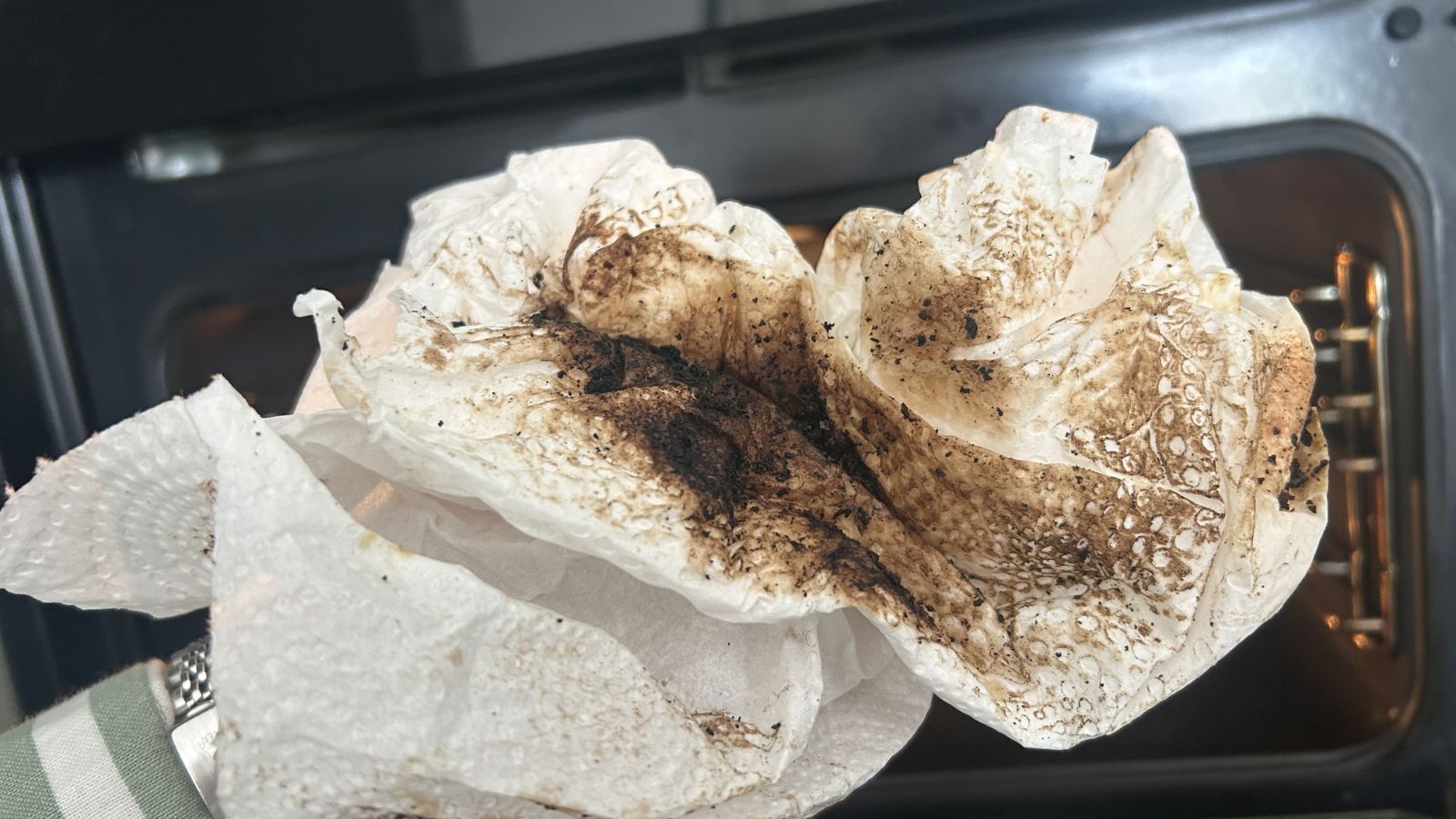 Oven cleaning hack - paper towel dirty with burnt on stains