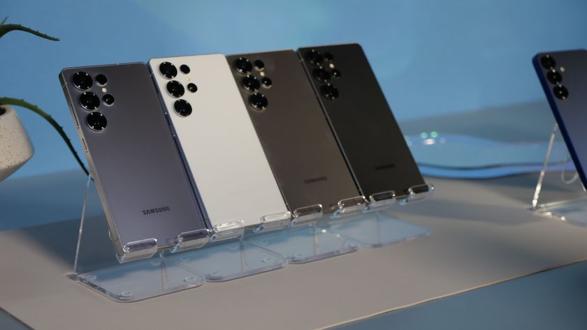 Samsung Galaxy S25 Ultra phones in all standard colors at an angle on clear stands.