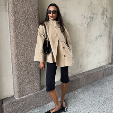 Ingrid in a funnel-neck short trench jacket, capris and ballet falts