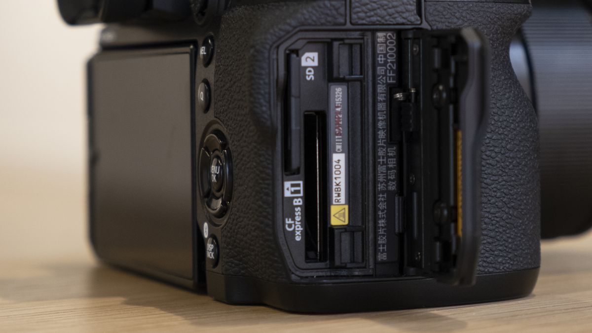 The Fujifilm X-H2S camera on a wooden table