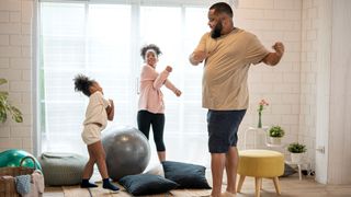 Lose weight at home: Image shows man and children exercising at home