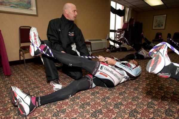 UnitedHealthCare riders get shown proper stretching techniques.