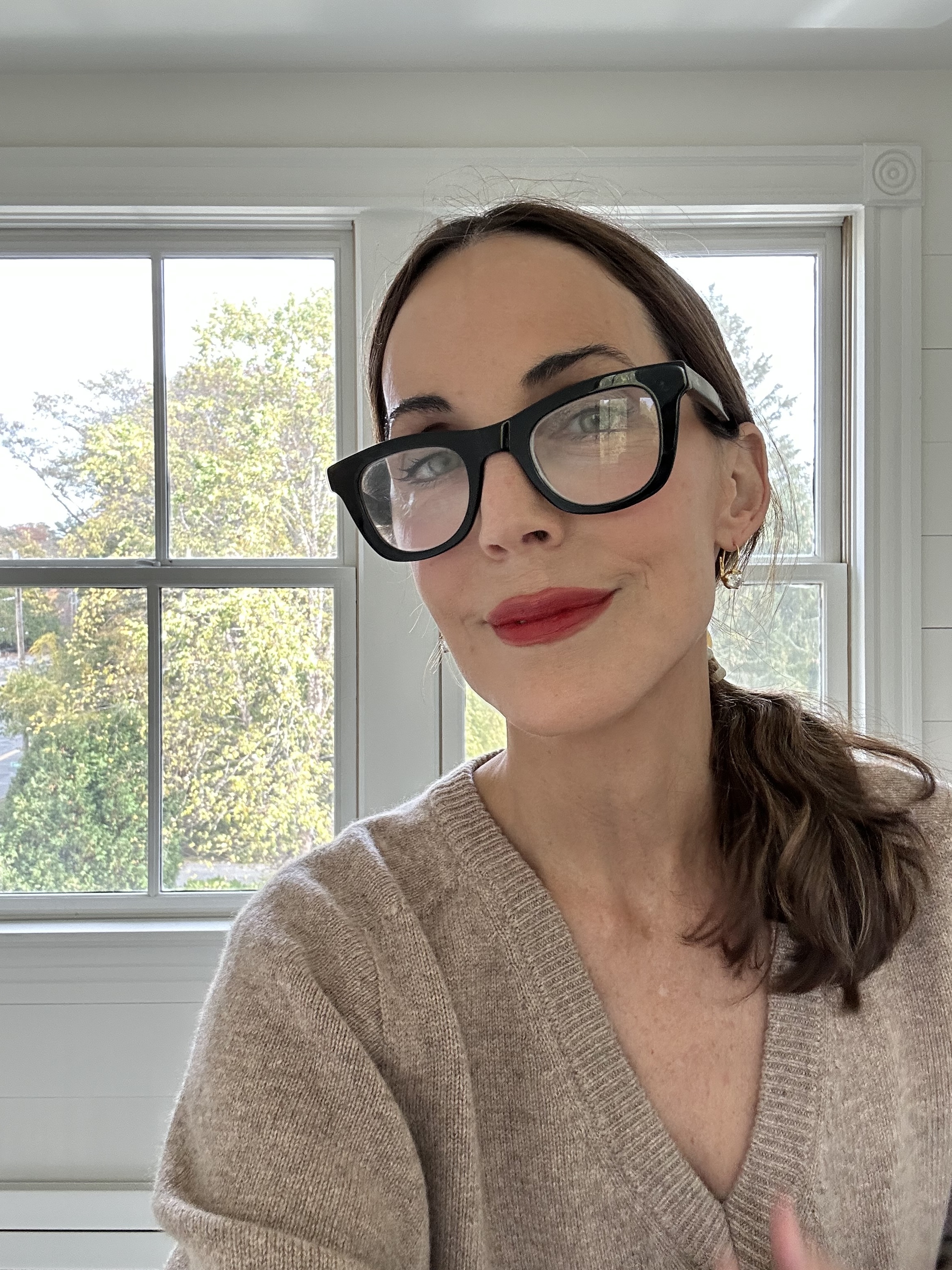 Larissa Mills accessorizes with a red lip