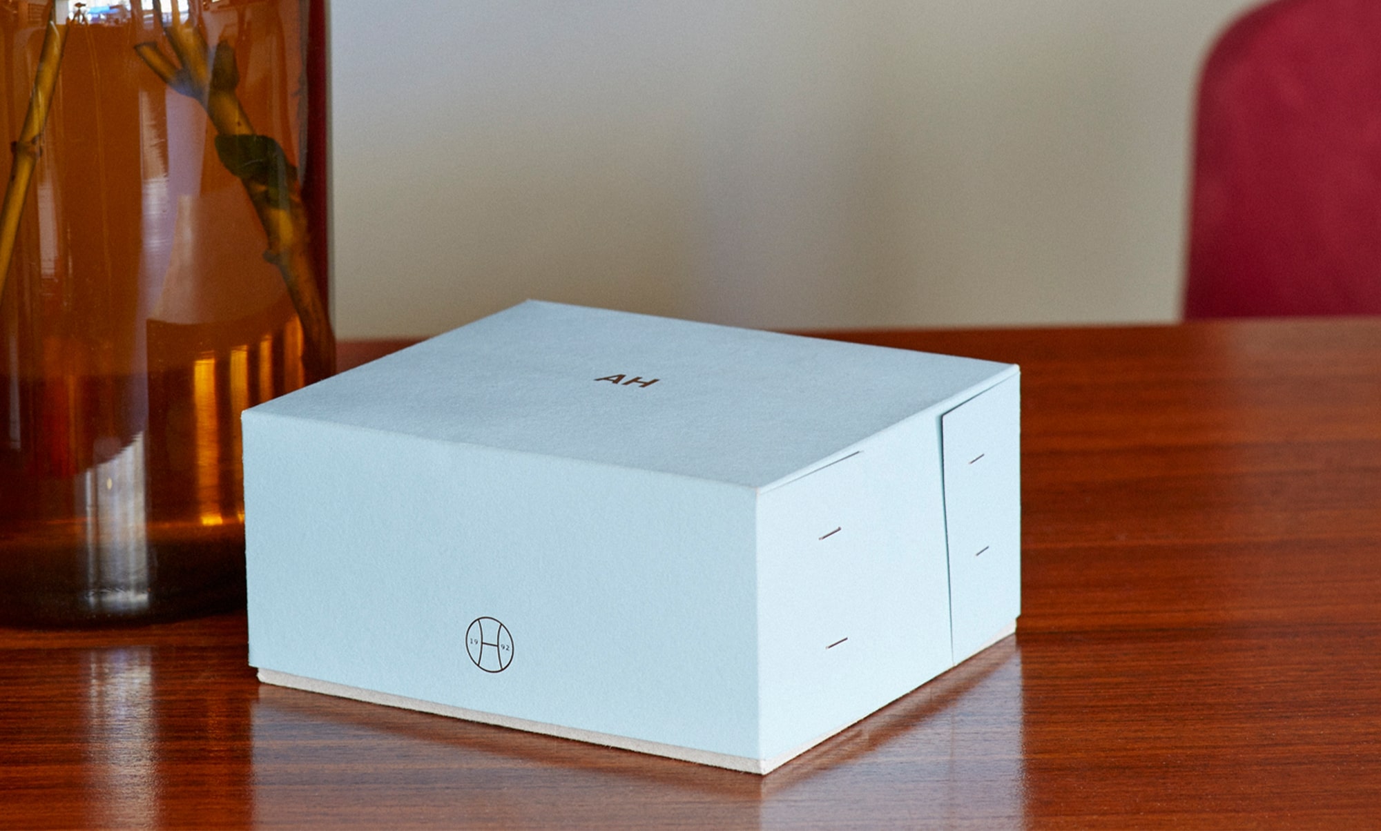 Perfume box on wooden table
