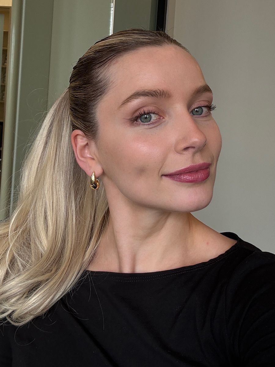 Social Media Editor Emma Hughes wearing a glossy, pink lip look with Glossier's Lip Liner Pencil, Violette_FR's Bisou Balm, and the Tower 28 Lip Jelly