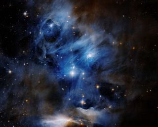 Hubble's view of the Chamaeleon Cloud Complex captures dark, dusty molecular clouds where new stars form, along with striking reflection nebulas, which glow bright blue from the light of nearby baby stars, and bright clumps and arcs of interstellar gas called Herbig-Haro objects.