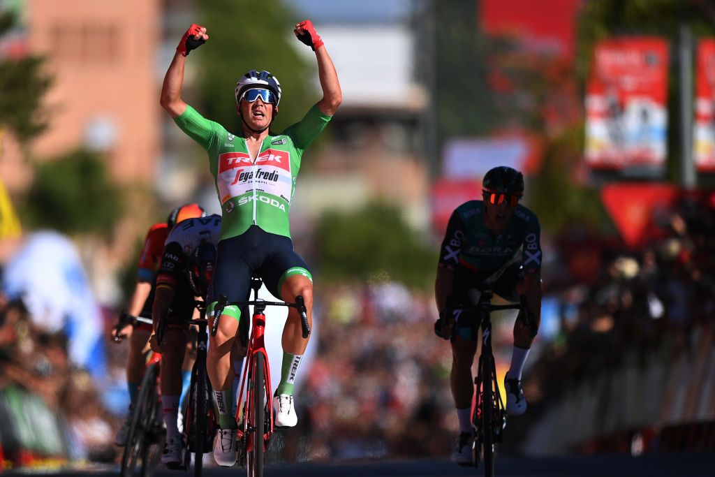TOMARES SPAIN SEPTEMBER 06 EDITORS NOTE Alternate crop Mads Pedersen of Denmark and Team Trek Segafredo Green Points Jersey celebrates at finish line as stage winner ahead of Pascal Ackermann of Germany and UAE Team Emirates and Danny Van Poppel of Netherlands and Team Bora Hansgrohe during the 77th Tour of Spain 2022 Stage 16 a 1894km stage from Sanlcar de Barrameda to Tomares LaVuelta22 WorldTour on September 06 2022 in Tomares Spain Photo by Justin SetterfieldGetty Images