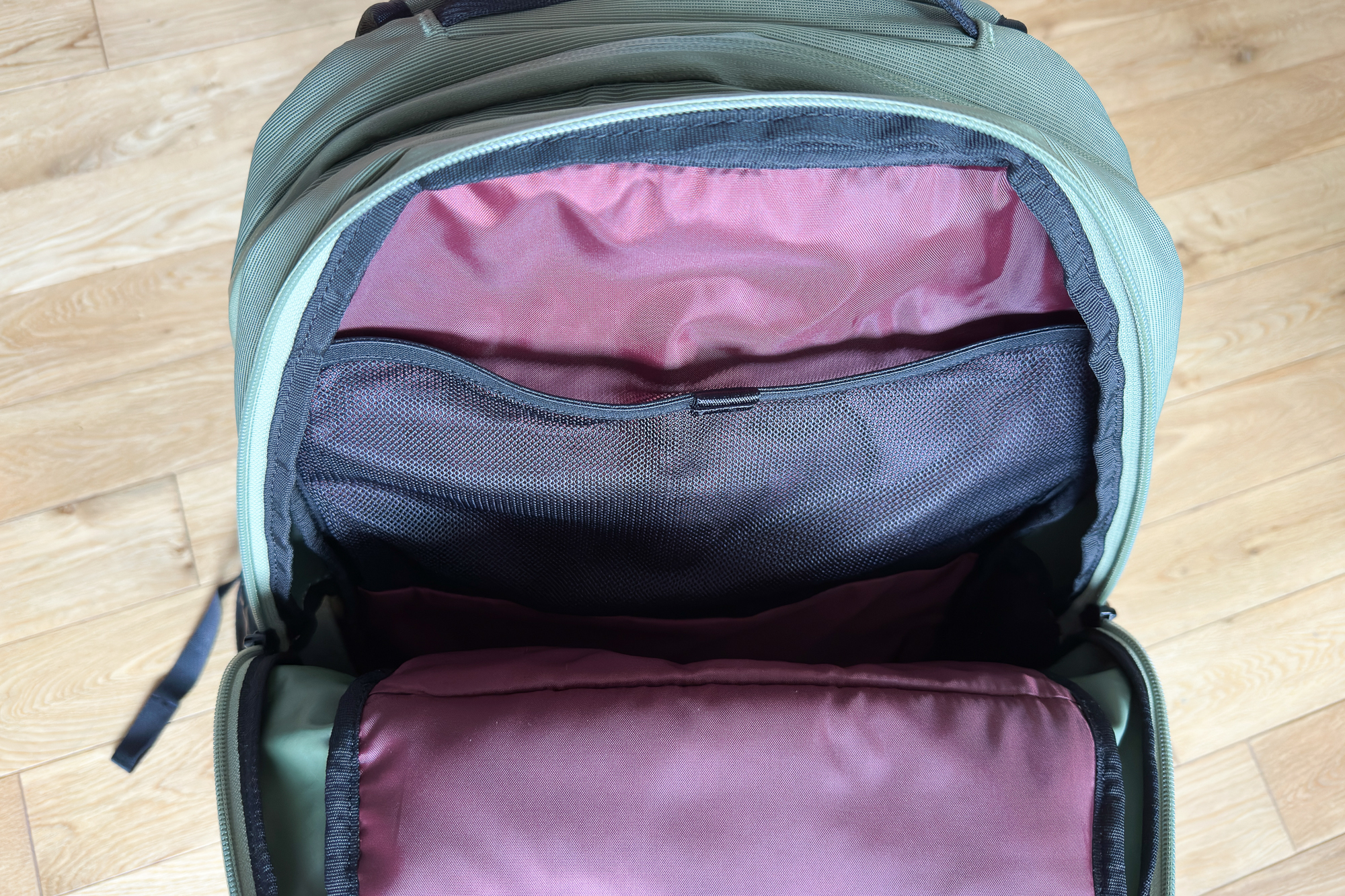 close up of a Thule Paramount Commuter Rucksack 27L showing the maroon interior and lots of pockets