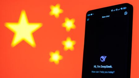 DeepSeek app on a cell phone in front of a Chinese flag