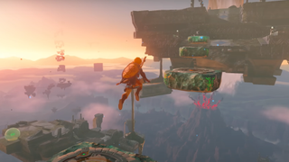 still from zelda video game showing numerous floating islands and floating rocks in the distance. in the foreground, link leaps to a large floating island with platforms in front