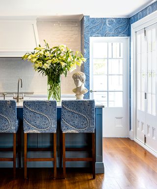 Kitchen with blue barstools