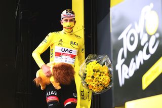 SAINTGAUDENS FRANCE JULY 13 Tadej Pogaar of Slovenia and UAETeam Emirates yellow leader jersey celebrates at podium during the 108th Tour de France 2021 Stage 16 a 169km stage from Pas de la Casa to SaintGaudens Lion Mascot LeTour TDF2021 on July 13 2021 in SaintGaudens France Photo by Michael SteeleGetty Images