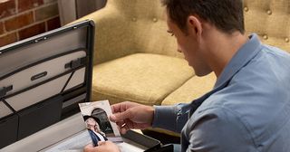 Aaron Brennan finds a photo of an unknown woman in Hamish Roche's briefcase in Neighbours.
