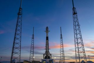 A used SpaceX Falcon 9 rocket carrying the Turkish satellite Turksat 5B communications satellite stands atop a pad at Cape Canaveral Space Force Station in Florida ahead of its planned Dec. 18, 2021. 