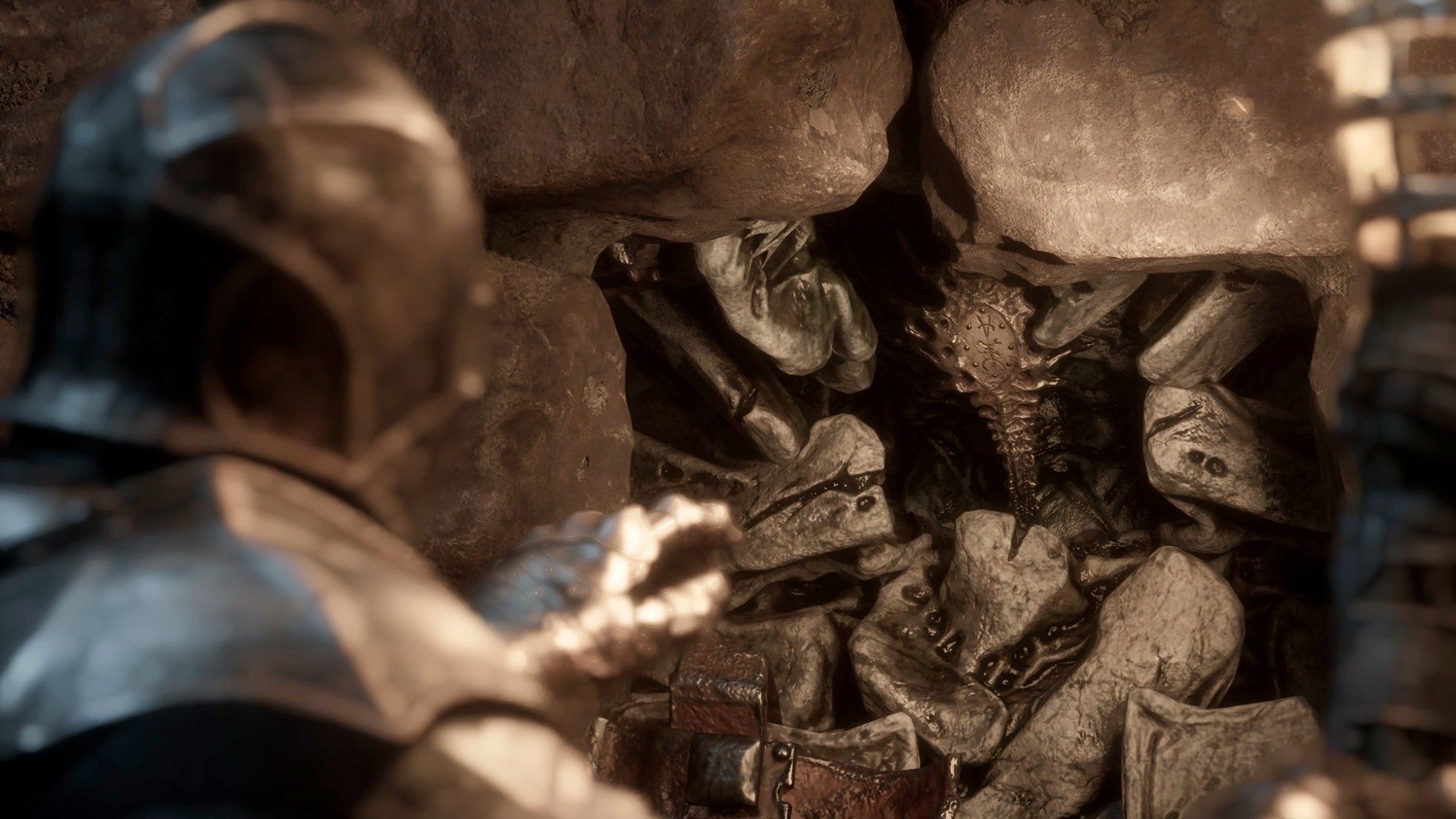 The player reaches out for Vatra's Seal, one of the Mortal Shell 2 Seals, which is embedded in a wall.