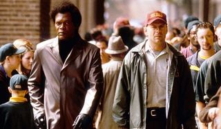 Unbreakable Samuel L. Jackson Bruce Willis Mr Glass and David walk through the crowd