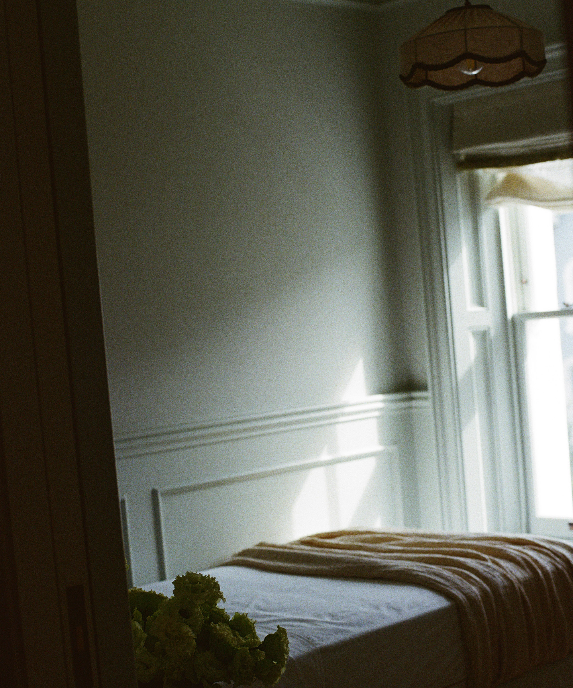 bedroom with a dim window letting in just a little bit of light