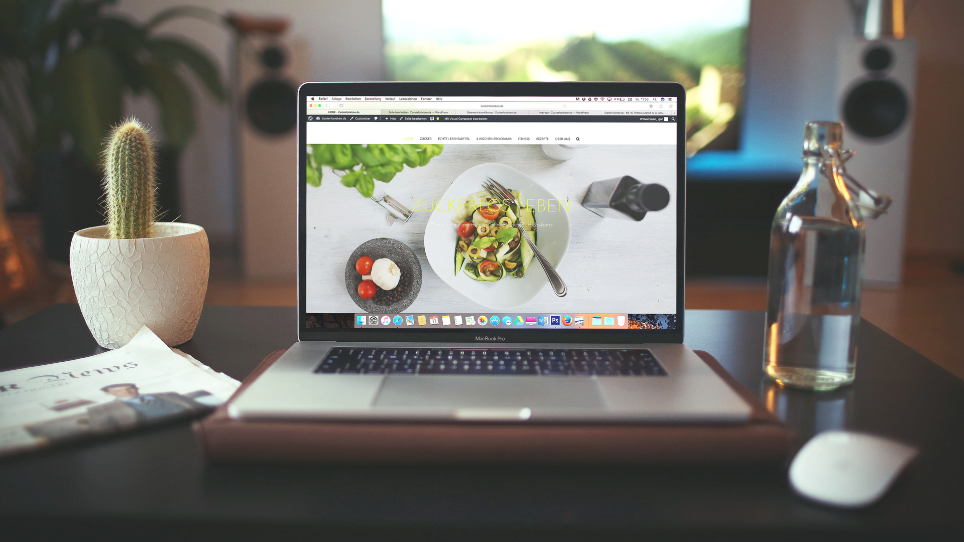 laptop on desk with food website loaded on screen