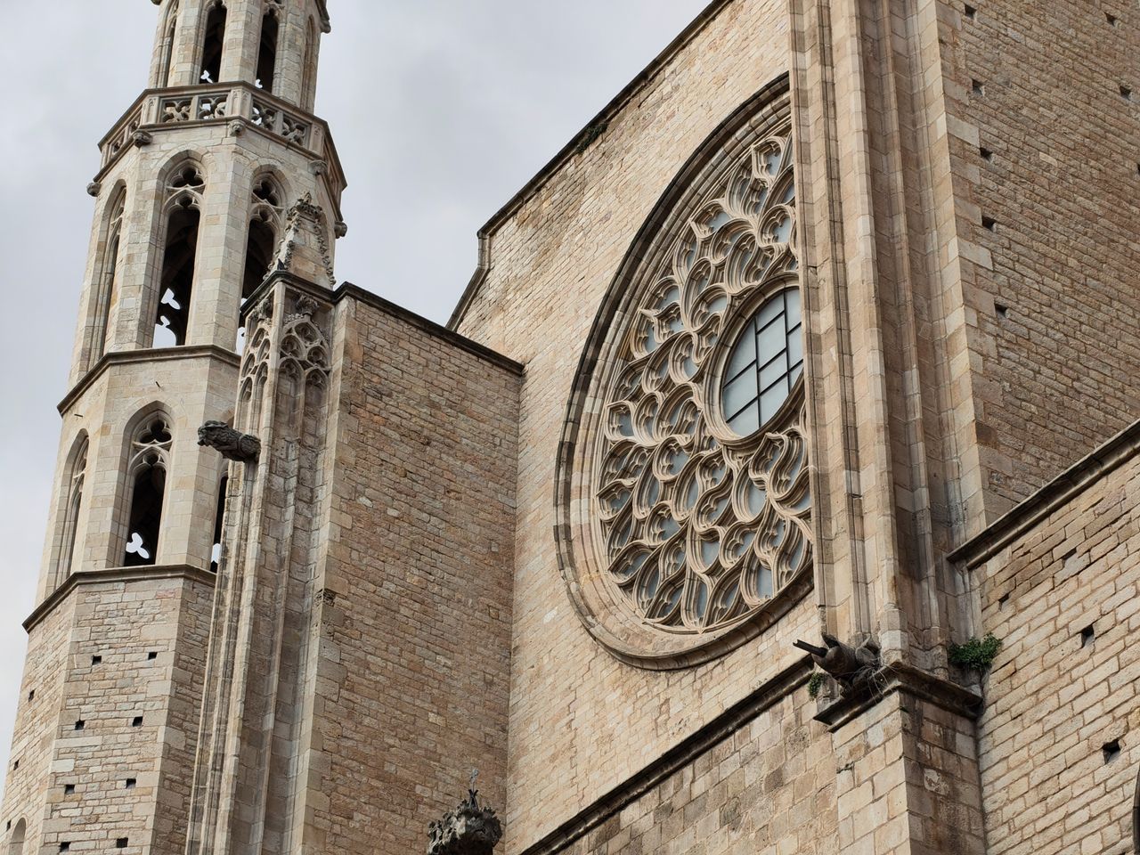 Closer view of a Gothic church facade highlighting its rose window and stonework details, photographed with the Nothing Phone (4a).