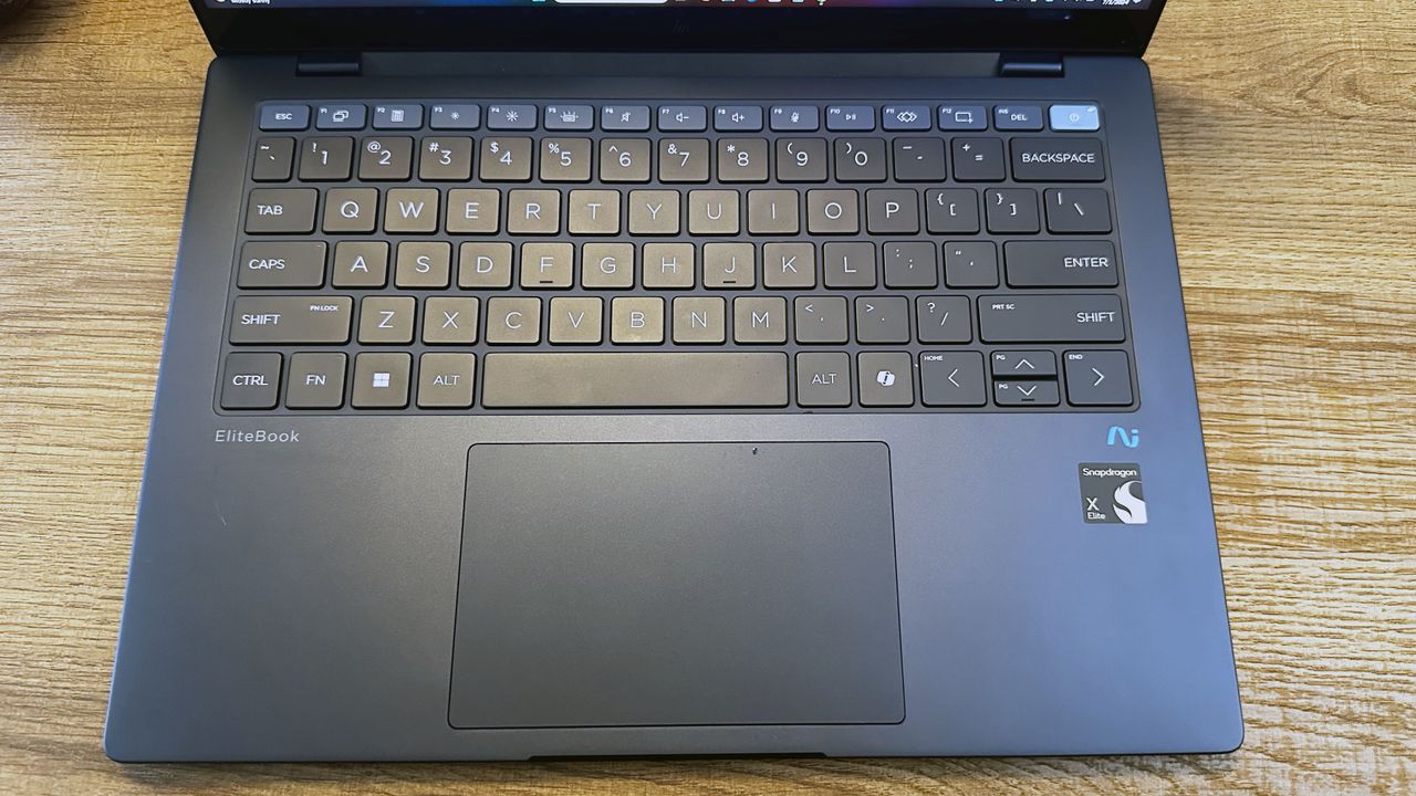 Top down photo the keyboard and touchpad on a laptop.