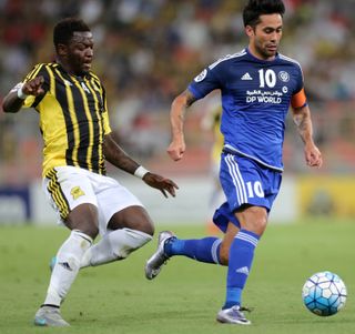 Sulley Muntari (left) of Al-Ittihad competes for the ball with Al-Nassr's Luis Antonio in March 2016.