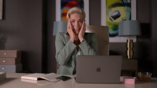 Hannah Waddingham holding both her hands up to her face and looking shocked on Ted Lasso.