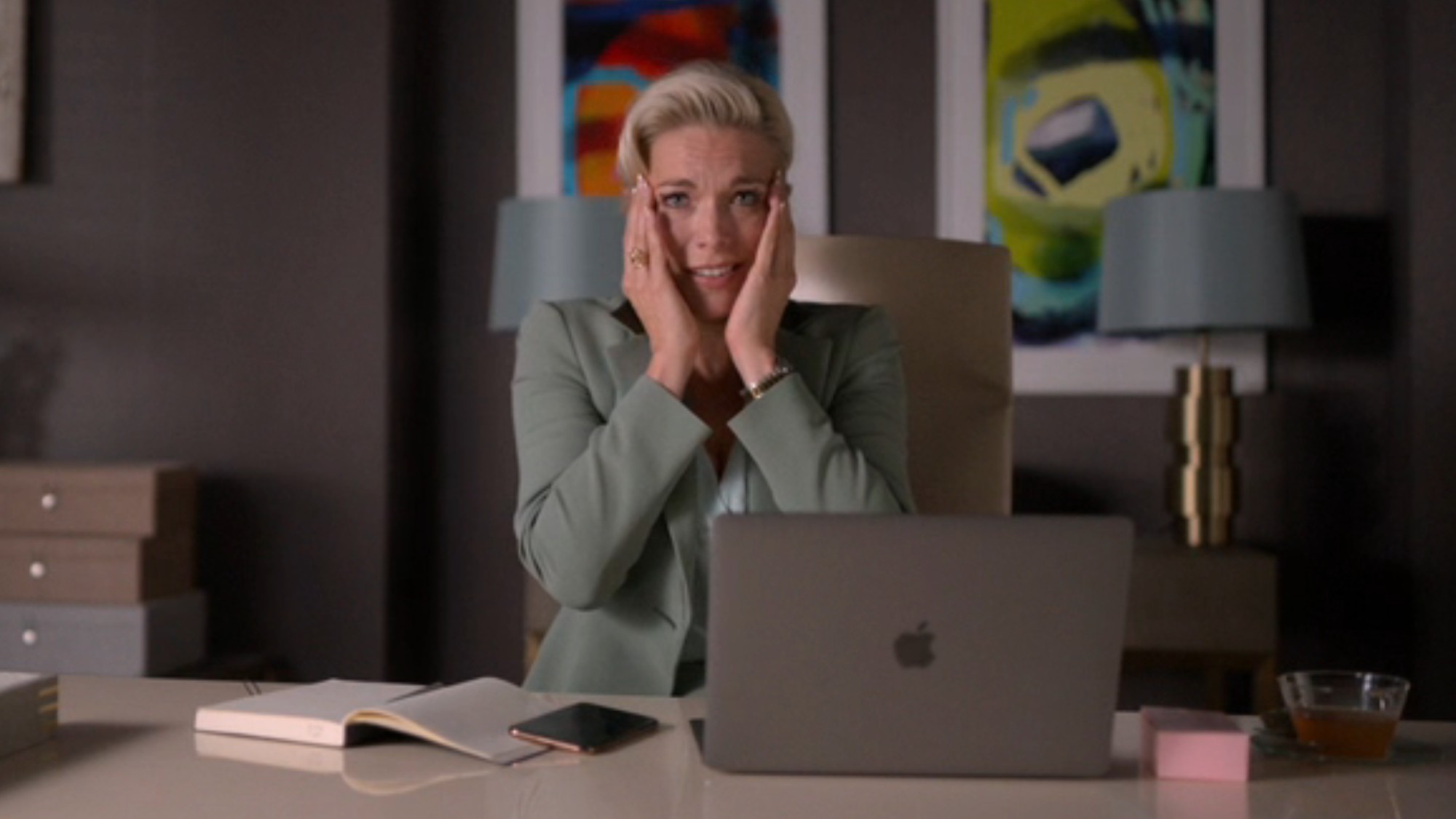 Hannah Waddingham holding both her hands up to her face and looking shocked on Ted Lasso.