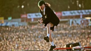 Angus Young of rock legends AC/DC captured at the Download Festival in 2010