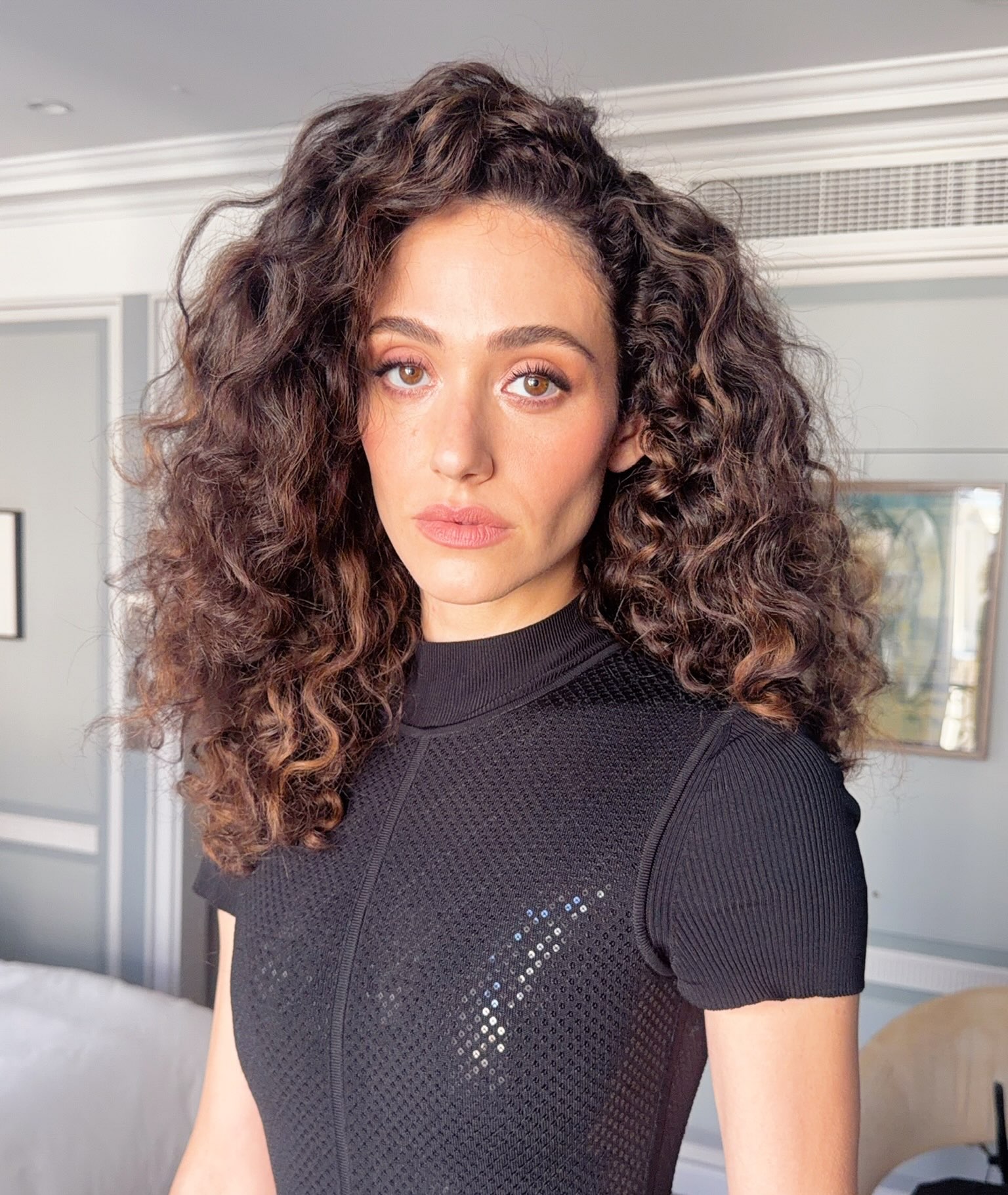 Emmy Rossum with dark hair with highlights