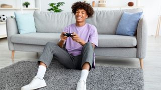 Teenager playing Playstation