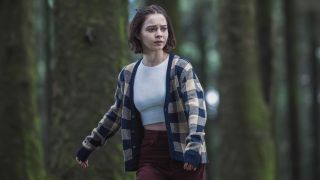 An image of Pip Fitz-Amobi (Emma Myers) running through a woodland setting in A Good Girl's Guide to Murder