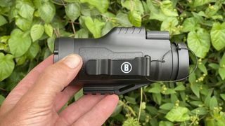 Bushnell Legend Ultra HD ED monocular 10x42 held up infront of green foliage
