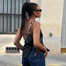 Street style photo of @lenafarl with lip gloss in her back pocket