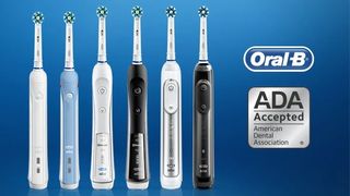 Oral B electric toothbrush deals: Image shows a range of Oral B electric toothbrushes on a blue background