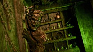 skeleton peaking out at Scarecrow Reaping house at Universal Horror Unleashed