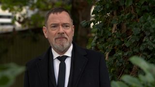 Ian Beale skulks in the bushes at Dot Branning's funeral