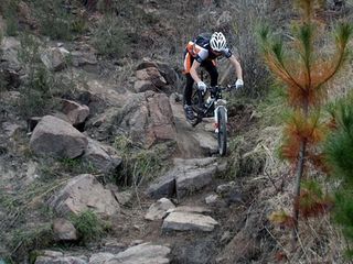 Rock me. Ben Henderson demonstrates the fine art of picking your way down a vertical boulder field.