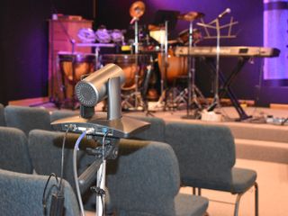 An auto-tracking camera is set up to stream a live worship service.