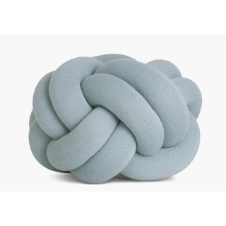 light blue knitted knot pillow
