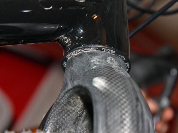 The straight 1 1/8" steerer tube on the Ritchey fork requires a reducer headset to fit into the tapered Specialized CruX head tube.