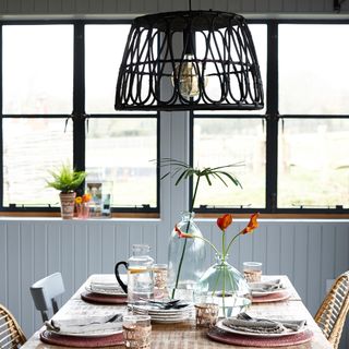 dining room with table and hanging lampshade