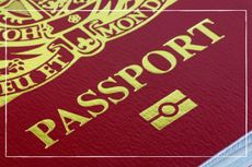 an extreme close up of a maroon British passport