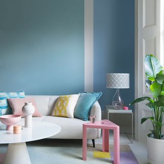 Living room with pastel wall paint, sofa and table